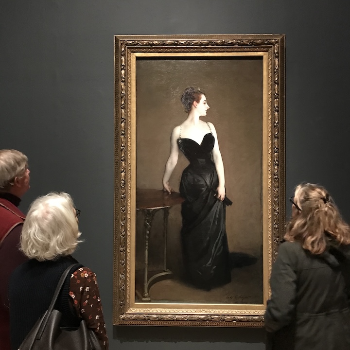 People staring at John Singer Sargent's Madame X portrait, currently on show in London