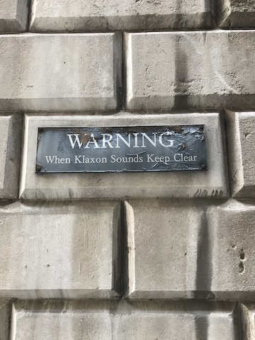 St Stephen's Row back of Mansion House get out when klaxon heard wall sign warning